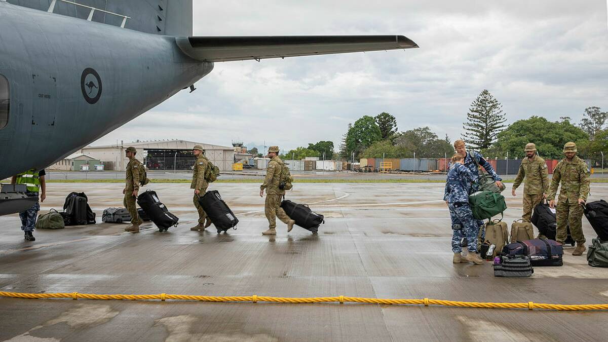 Royal Australian Air Force Aviators board a C-27J Spartan at RAAF Base Amberley, bound for Western Australia. Photo: CPL Brett Sherriff.