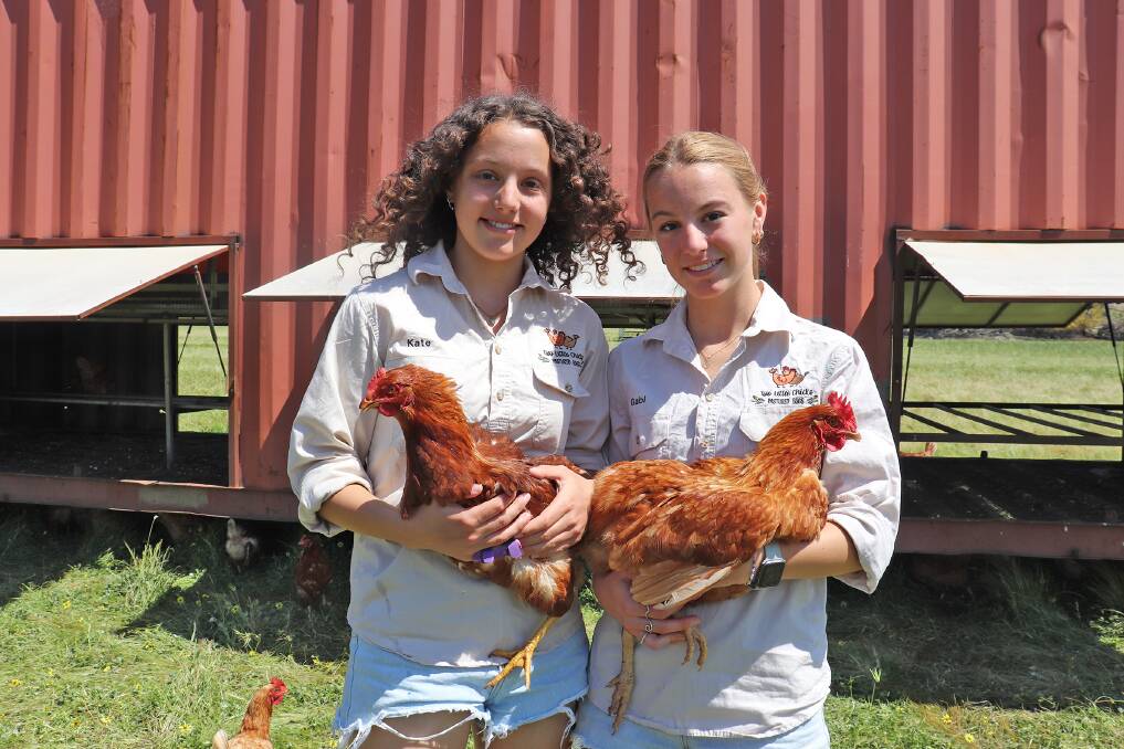 Fifteen-year-old Kate Cousins (left) and her sister Gabi, 17, have turned Gabis hobby into a thriving pastured egg business, run from their familys farm at West Popanyinning.
