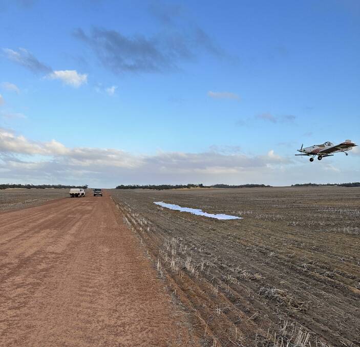 John Warr from Waringa Aviation practiced over and over using sheets in a paddock to ensure precision with canola seed application from his plane.