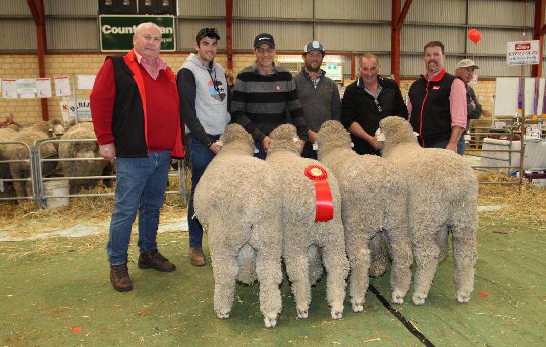 Kevin Broad (left) and Nathan King (right), Elders stud stock, congratulated the East Strathglen stud, Tambellup, on placing second in the Elders Expo Four shorn before April 20 class. With the group of March shorn Poll Merino rams were Braden and Robert Lange, Narrogin, East Strathglen stud principal Rohan Sprigg and Terry Crapella, Kojonup.