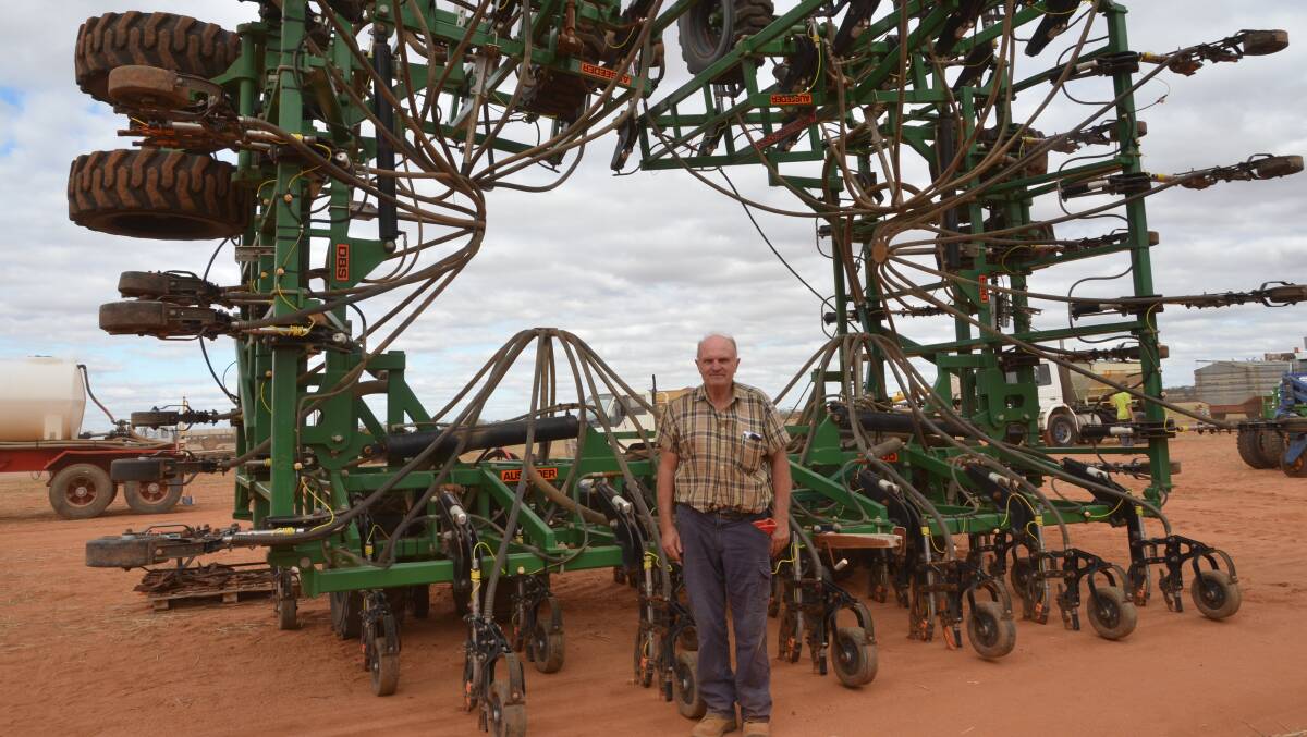 Two clearing sales and two seeding bars bought in less than two weeks. Wongan Hills farmer Graham Bookham with the 18.2 metres Ausplow Auseeder DBS D-300 seeding bar set up with double shot and liquid, he bid $215,000 for on Thursday last week. The week before at a Pindar clearing sale, Mr Bookham and his son Stephen paid $180,000 for a complete Ausplow seeding rig of tow-between Multistream air cart and 15.2 metre DBS D-300 bar.