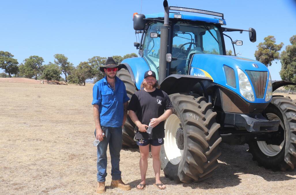 Jake Smith, Cranbrook (left), Ben Gibson, Kendenup, inspecting some of the machinery before the sale. The T7060 New Holland tractor sold for $77,500 topping the sale.