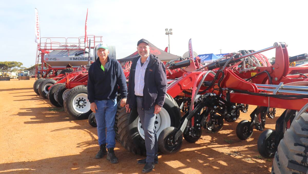 Murray Leach (left), Corrigin, with McIntosh & Son Distributions Morris specialist Eliot Jones and the first 24 metre Morris Quantum seeding bar in Western Australia. Mr Leach said his 12m Morris Quantum seeding bar had recently been bogged and had taken seven hours to extricate. Difficulty in finding skilled farm labour meant a purchasing decision was now between buying a second smaller bar or trading up to the biggest unit available.