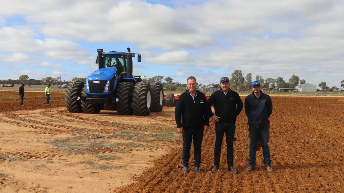 McIntosh & Son Merredin branch manager Rob Pauley (left), with Waringa Distributions general manager Sam Abbott and sales and service representative Jake Isaac. The New Holland T9.615 tractor behind them is pulling a 2023 12 metre Gregoire Besson speedtiller which is imported from France by Waringa.