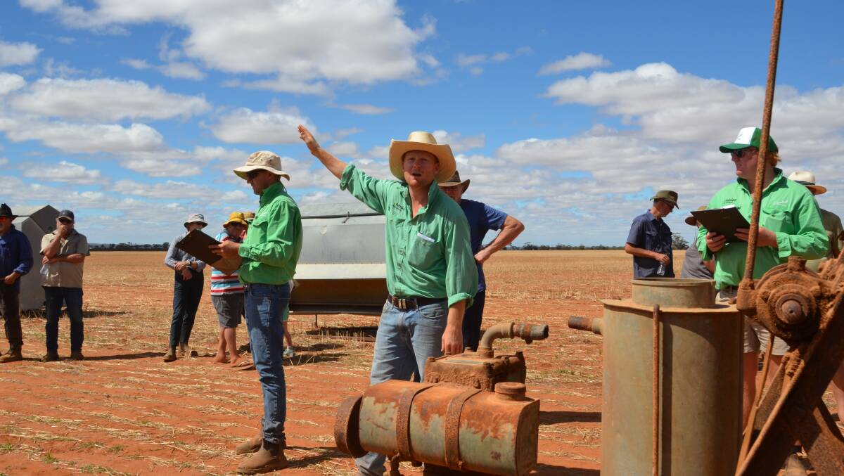 Nutrien Ag Solutions auctioneer Daniel Major selling a vintage single-cylinder Lister portable two-stand shearing plant for $280. Mr Major tag-teamed with fellow Nutrien auctioneer Jarrad Hubbard to get through the 244 lots in hot, windy conditions.