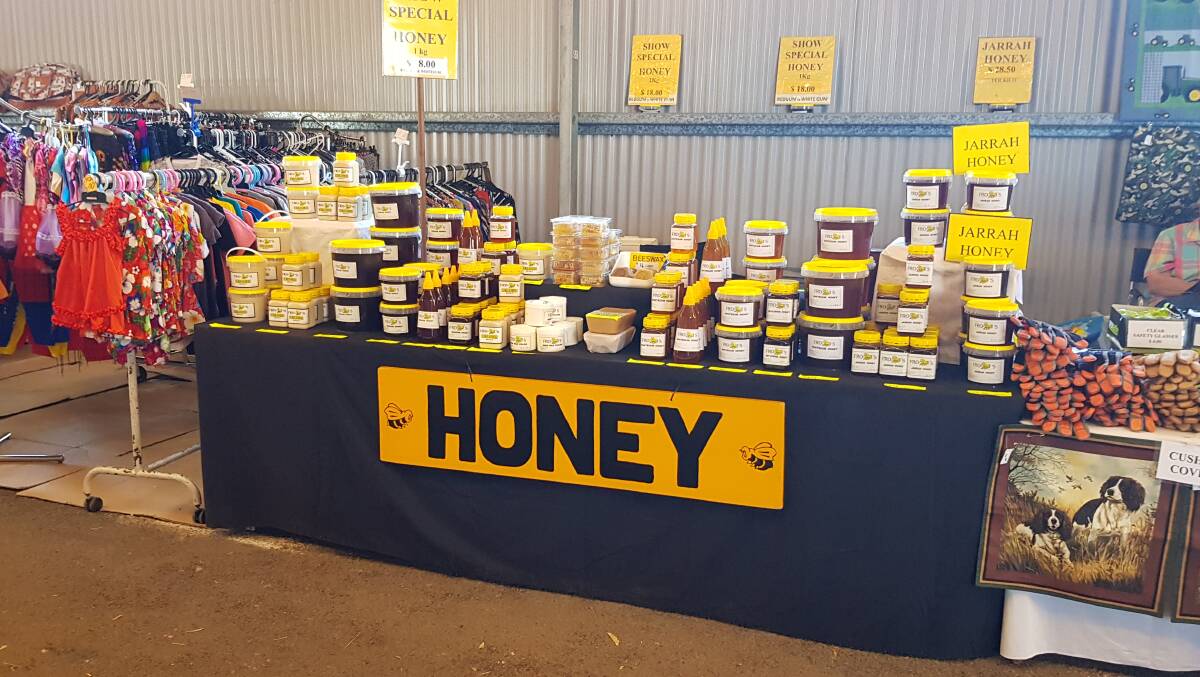  The lady sitting on the right of the Frobees Honey stand is Carol Froby, who still attends the Woolorama every year, selling her quilted and sewn crafts alongside Frobees Honey stall and has been a long-time exhibitor.