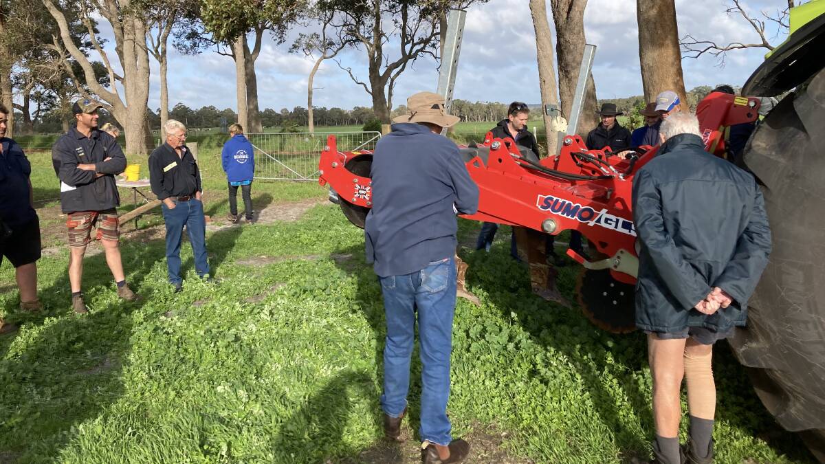Producers inspect equipment used in one of the Soil Wise Pasture Challenges treatments in June 2023.