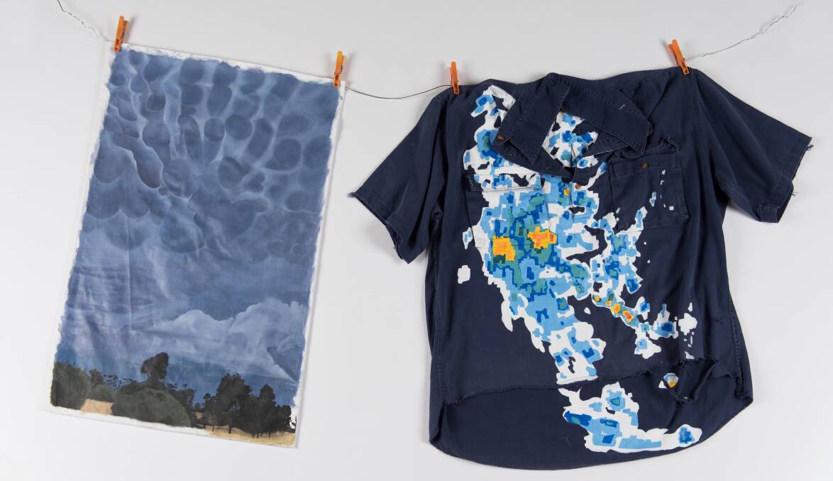Ms Holmes paintings were among 60 pieces chosen from 300 entries to be included in the annual Pulse exhibition. The piece on the right incorporates an image of a Bureau of Meteorology radar map taken over their farm, which she painted on one of her fathers old work shirts.
