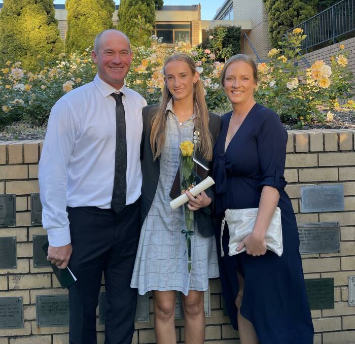 > Tayah (centre), with her dad Colin and mum Jacinta at her year 12 graduation from Penrhos College last year.