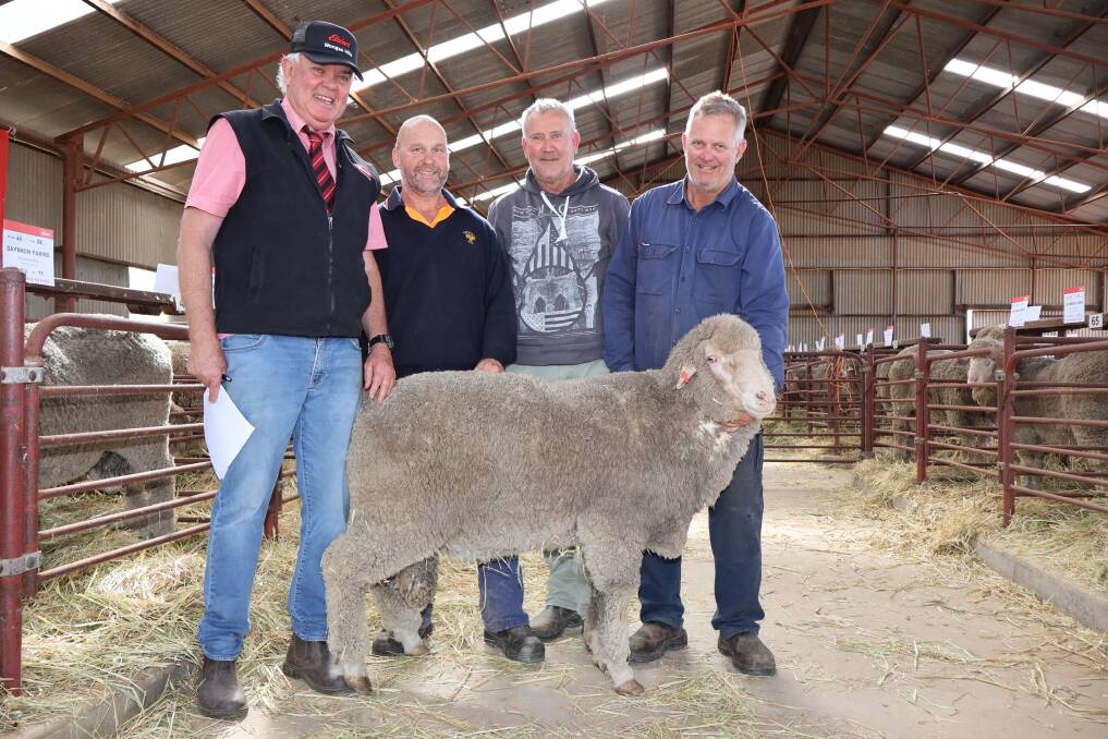 Elders Wongan Hills agent Jeff Brennan (left), buyer Lincoln Meade, Whaddon Farms, Calingiri, Mocardy stud assistant Dean Griffiths, Wongan Hills and Mocardy stud principal, Dave Millstead, Wongan Hills, with the $1200 top-priced Mocardy ram at the Wongan Hills and Districts Breeders Ram Sale.
