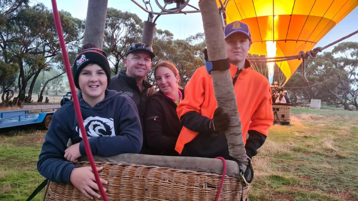 Northam pilot Peter Clements with his kids Zane (left), Zara and Evan in his hot air balloon named Bradley.