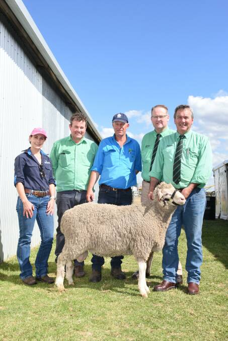 Prices hit a high of $19,000 at the Moojepin Merinos on-property ram sale at Katanning for this ram when it sold to a buyer from South Australia bidding on AuctionsPlus. With the ram are AuctionsPlus representative Trinity Edwards (left), Nutrien Livestock Breeding representative Mitchell Crosby, Moojepin co-principal David Thompson, Nutrien Livestock auctioneer Tiny Holly and Nutrien Livestock stud and commercial sheep manager Tom Bowen. 