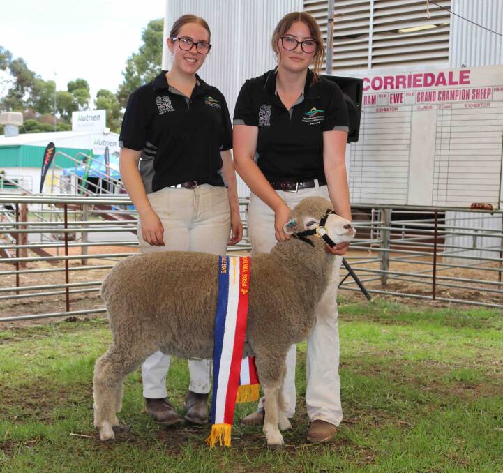 Inlet Views representatives Grace Lee and Sarah-Jane McCall with the champion Corriedale ewe.
