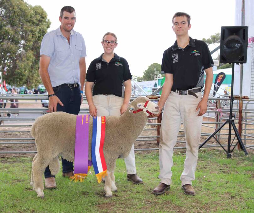 Judge Braden Lange, Narrogin, with Grace Lee and Jesse Oldfield, Inlet Views, and the grand champion and champion Corriedale ram.
