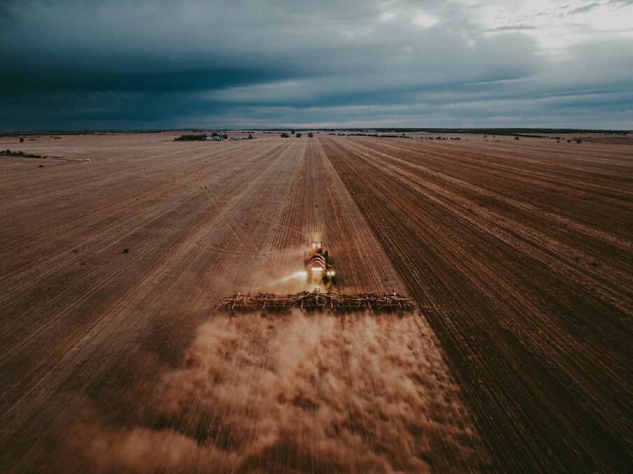 Seeding while the rain clouds are coming at Perenjori. Photo: Ellie Morris.

