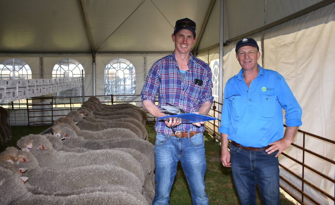 South Australian producer Robbie Bateman (left), The Batchell Ag Trust, Furner, was the volume buyer in the sale purchasing 22 rams to a top of $3000 and an average of $1923. Mr Bateman discussed his selections with Moojepin co-principal David Thompson.