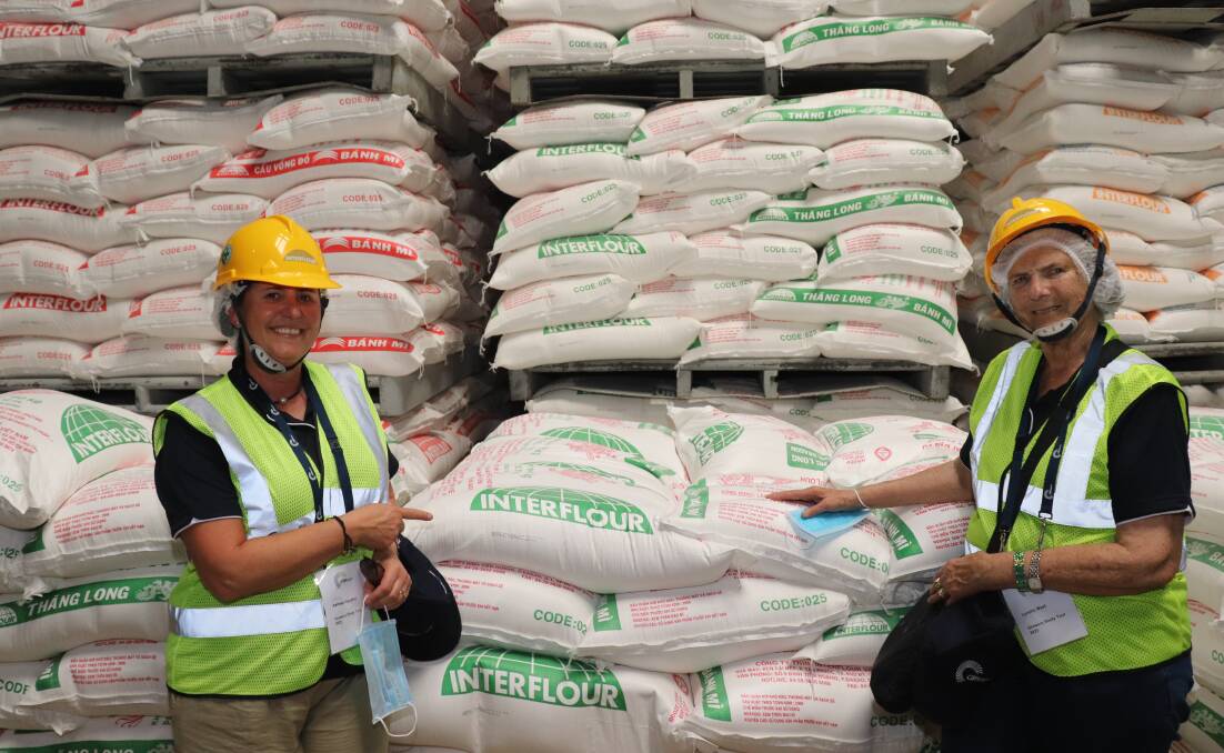 Kate Caughney (left), Nukarni, with Lyn West, Jennacubbine, pointing at one of the many bags of Interflour flour.
