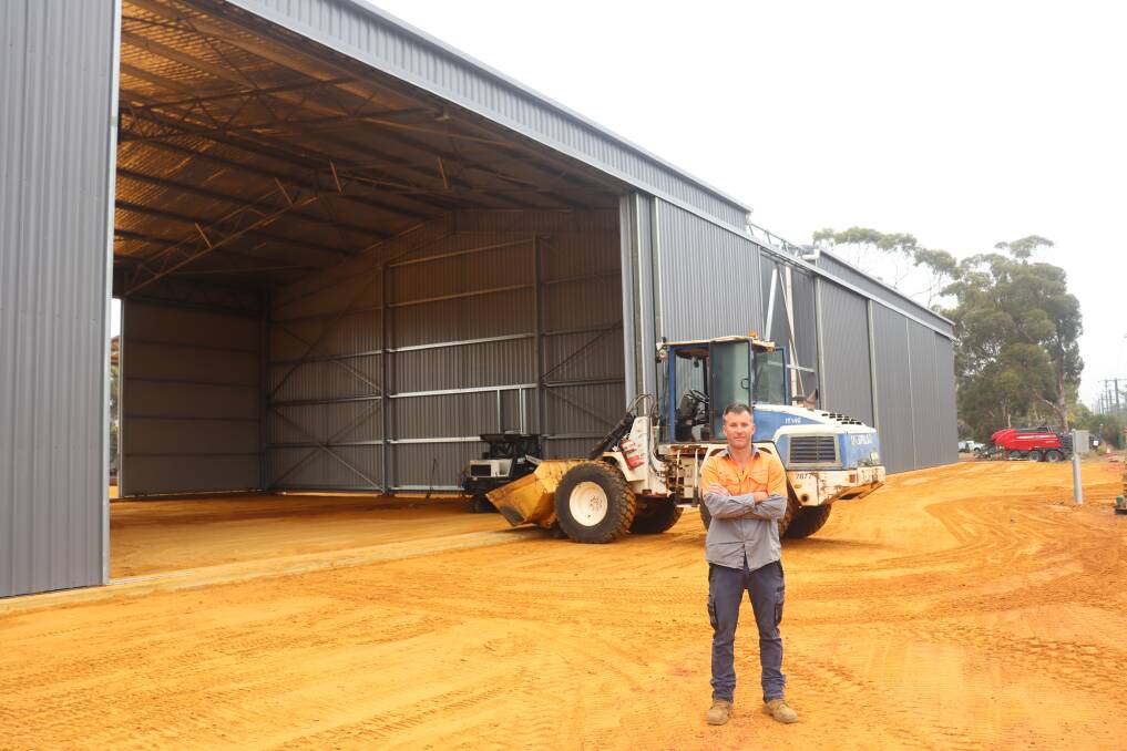 Damien Rushton, H Rushton & Co, Brookton, in front of the two sheds that will be the new service workshop and assembly area for new agricultural machinery.
