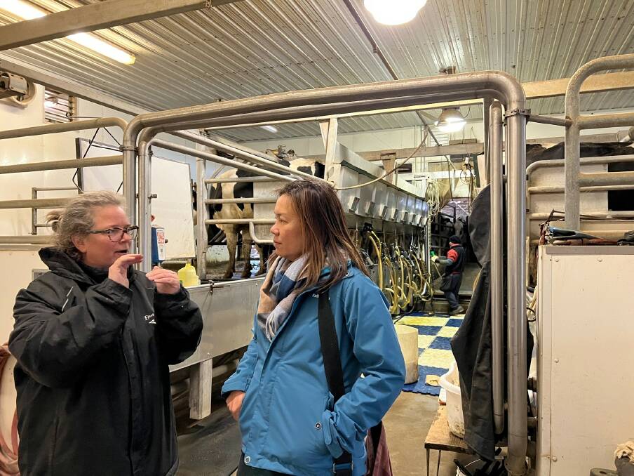 A dairy producer in Wisconsin Dells speaking to I-Lyn Loo (right), who was conducting research for her Churchill Fellowship report on regenerative agriculture.
